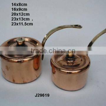 Copper saucepan with pewter lining and brass handles polished