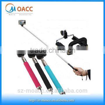 Hand held travel selfie stick with bluetooth remote shutter