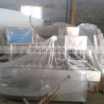 Plastic cup filling and sealing machine