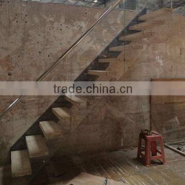 floating stairs with wooden tread and frameless glass railings