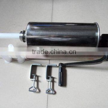 Hand operated larger capacity sausage stuffer with three nozzles