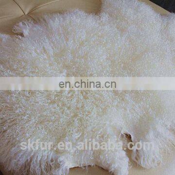 Tanned raw white curly lamb fur