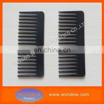 Plastic hair comb with wide teeth