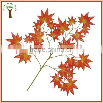 artificial maple leaves and branches in red color