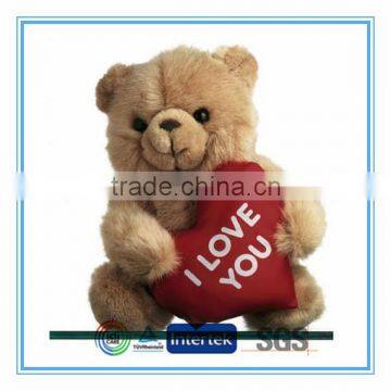 Stuffed bear holding a heart