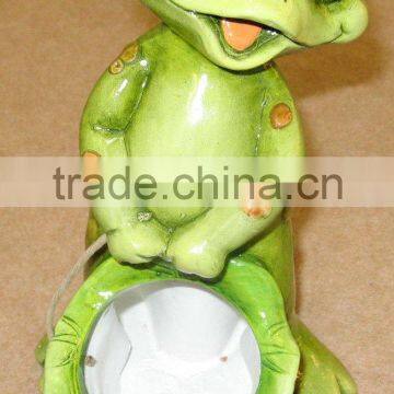 Terra cotta frog with planter