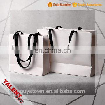 Custom emboss logo woven tape handle decorative craft paper bag