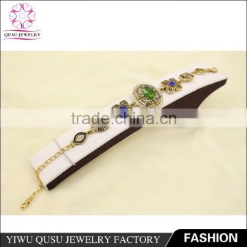 2015 Yiwu new products antique gold plated bracelet with rhinestone and emerald imitation jade