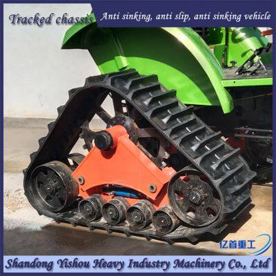 Tractor modified with rubber track chassis to increase original vehicle power