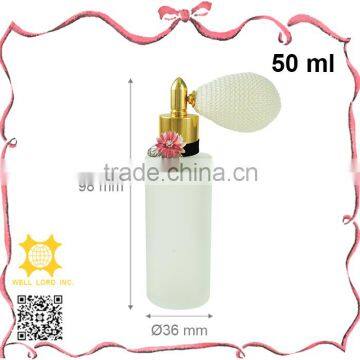 Delicate frosted perfume bottle with pink flower bulb atomizer