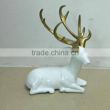 Resin sitting reindeer statue