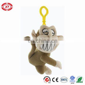 Weird monkey plush toy making grimace keychain