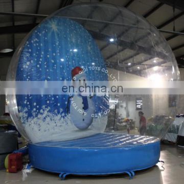 Inflatable snow globe