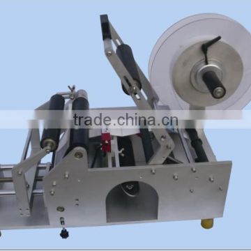 Manual round bottle labeling machine