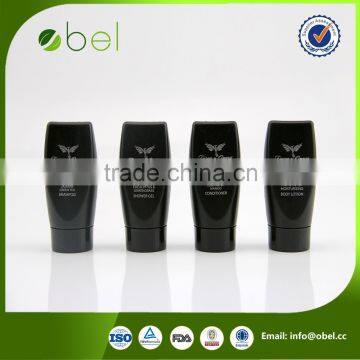 hotel hair shampoo in black inverted bottle
