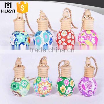 wholesale hanging type round shape wooden cap car perfume bottle                        
                                                                                Supplier's Choice