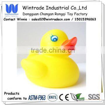 Yellow baby toy floating on water duck