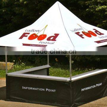 Folding tent with folding table and half wall for advertising or event