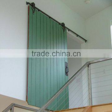 Sliding contemporary barn door for staircase