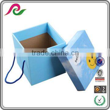 Blue folding corrugated paper box with handle for gift packing