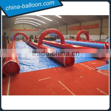 300m inflatable double lane slip slide / red color giant inflatable slideway