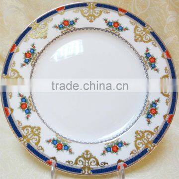 Bone china dinner plate of round shape with blue and gold decal