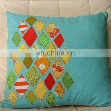 cushion cover with appliqued diamond shape