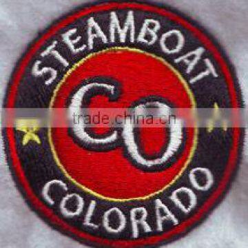 Big letter CO in a round shape design embroidery badge,custom 100% embroidery patch