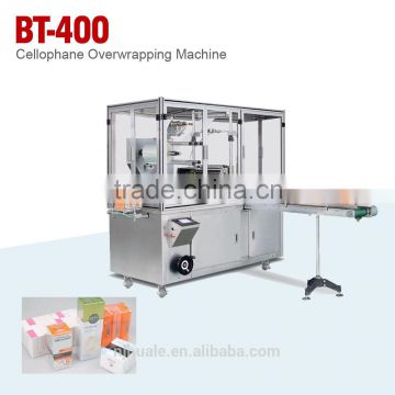 CELLOPHANE OVERWRAPPING MACHINE