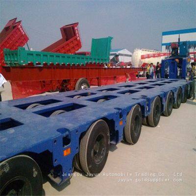 Heavy duty low flatbed export semi-trailer for large transport vehicles