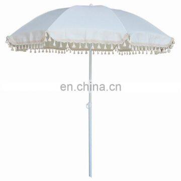 white beach umbrella with fringe