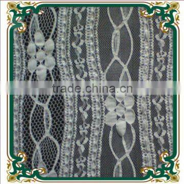 Cotton and nylon dotted Jacquard lace fabric