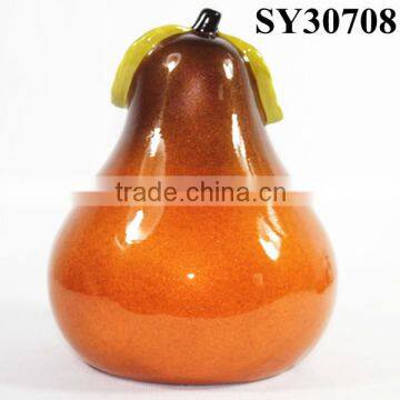 Small orange glazed ceramic pear shape fruit decoration