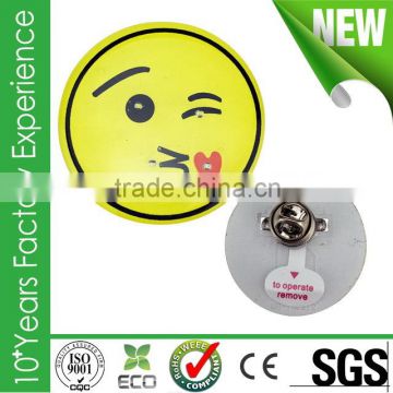 Made in china metal flashing led christmas tree smile face badges