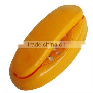 Yellow ABS plastic RJ11 trimline corded telephone