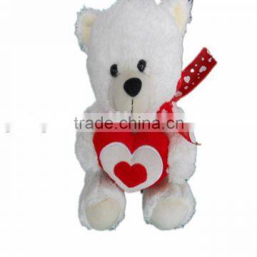 pretty plush bear holding heart