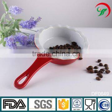 China suppliers kitchen cookware ceramic baking pans with red handle