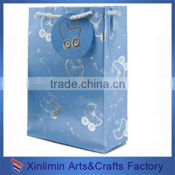 Blue gift paper bags with a silk bow for shopping