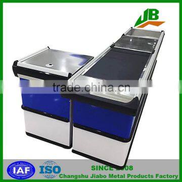 checkout counter with conveyor belt used in supermarket