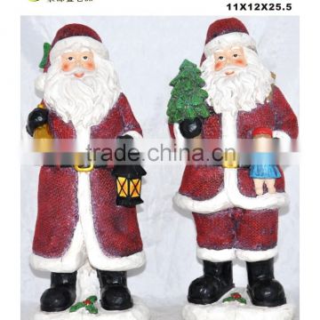 Resin santa figurine holding christmas tree set of 2