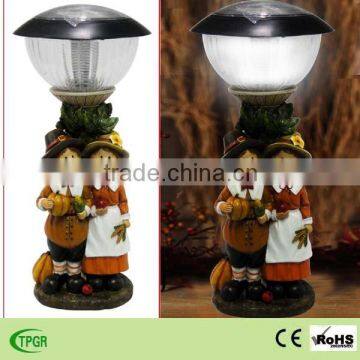 Polyresin children couple figure solar lighting for autumn harvest festival decoration