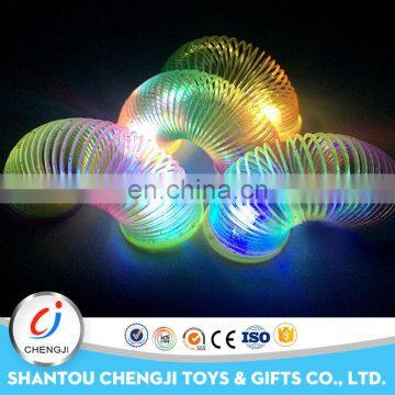 Funny plastic moving glow bouncing toy rainbow spring for kids