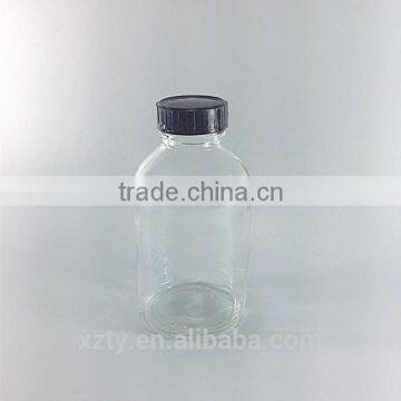 clear glass Boston round bottle