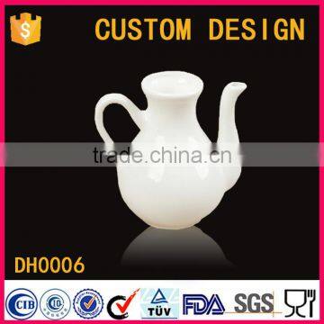 white ceramic vinegar pot