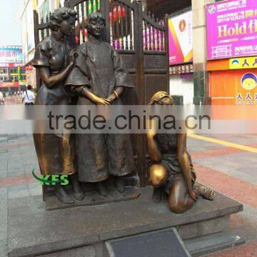 Bronze street statues of western and eastern ladies