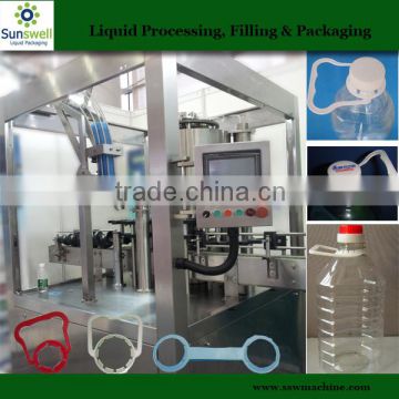 Oil bottle handle inserting machine