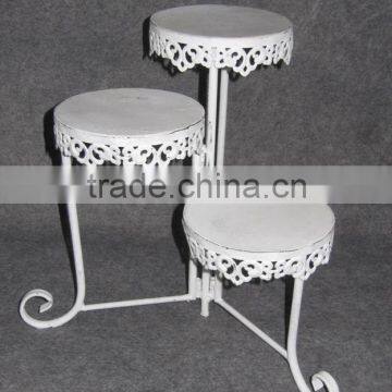 Distressed white collectable tiered metal stand