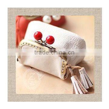 Frame with cherry and tassel coin purses