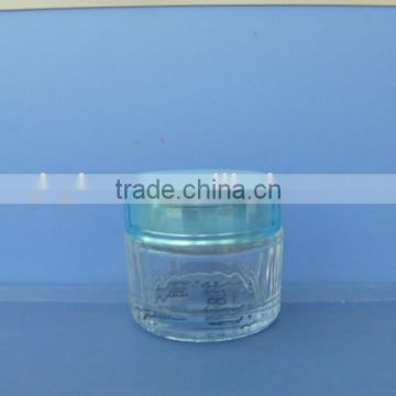 empty glass body cream jar with plastic cap