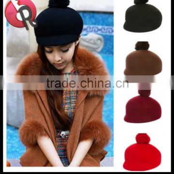 wool felt hat with fur ball on the top